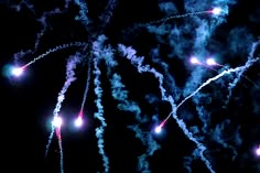 fireworks are lit up in the night sky