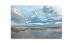 the sky is reflected in the water on the beach at low tide, with clouds above it