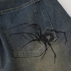 Unleash your edgy side with our Spider Denim Shorts. 🕷️🩳 These unique shorts feature a captivating spider-themed design, adding a touch of intrigue and attitude to your summer wardrobe. Crafted with high-quality denim, they offer both comfort and durability. Elevate your casual look with these trendy and bold shorts. Whether you're exploring the urban jungle or hanging out with friends, our Spider Denim Shorts will make a statement. Order now and weave a web of style and confidence in your sum Spider Web Jeans Diy, Customized Clothes Ideas, Spider Pants Design, Denim Shorts Painting, Painting Ideas For Jeans, Drawing On Shorts, Things To Draw On Pants, Diy Fabric Painting Ideas, Diy Clothes Painting Ideas