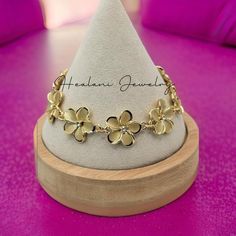 This plumeria bracelet features cubic zirconia stones in each plumeria flower. Easy to put on and take off with lobster closure clasp. The plumeria flowers on this bracelet measures 18mm width. This bracelet has an attached 3 inch extender so you can adjust to your size from 6.5 - 9 inch wrist.  Here is the matching earrings: https://www.etsy.com/listing/1774987703/plumeria-stud-earrings-hawaiian-earrings?click_key=f3a4bd8dd45cc1d5495ac734b87db37181ed5605%3A1774987703&click_sum=6050e810&ref=shop_home_active_2 Luxury Flower Charm Bracelet Jewelry, Guam Jewelry Gold, Cheap Flower Bracelets For Vacation, Cheap Flower-shaped Bracelets For Vacation, Plumeria Bracelet, Bratz Tv Show, Hawaiian Earrings, Jewelry Moodboard, Jewelry Gold Bracelet