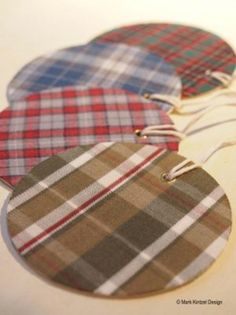 three plaid heart shaped tags hanging from strings