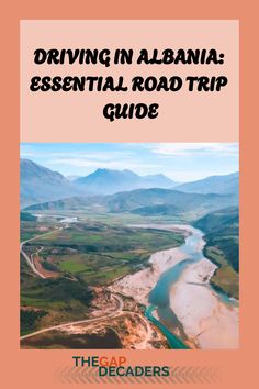 the cover of driving in albiana essential road trip guide, with an aerial view of mountains and rivers