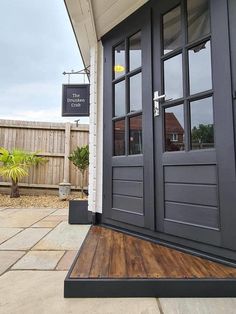 the front door of a building with wooden floors