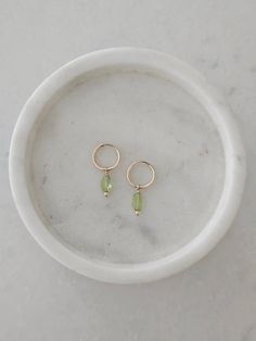 14k gold filled Peridot huggie hoop earrings.  Perfectly lightweight and great for everyday wear.   Great addition to our pearl huggie hoop earrings. Hoops are 12mm in size This item arrives in a gift box for easy giving. Thanks so much for stopping in!  ♡ Minimalist Everyday Huggie Earrings With Birthstone, Green Minimalist Small Hoop Huggie Earrings, Dainty Everyday Birthstone Hoop Earrings, Dainty Green Huggie Hoop Earrings, Minimalist Green Hoop Huggie Earrings, Minimalist Green Huggie Hoop Earrings, Green Minimalist Huggie Hoop Earrings, Everyday 14k Gold Filled Birthstone Earrings, Dainty Green Huggie Earrings As Gift