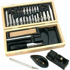 an assortment of kitchen tools in a wooden box