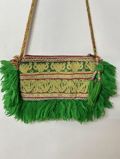 Ethically made with love, With its elegant and understated simplicity, this boho bag is made with vintage afghani zari patches and would be a great companion on music festivals, rock concerts, or any adventure around the world. Carry a bit of boho with you wherever you go. Product Description length : 6" width : 9" Material: Vintage Banjara Afghani zari  Fabrics  Style: Sling (19" Approx) Style tip : Throw in a pair of jeans with a summery top. Alternatively, you can pair it with any of ethnic I Kutchi Work, Rock Concerts, Boho Handbag, Boho Handbags, Boho Bags, Rock Concert, Indian Attire, Vintage Bag, Music Festivals