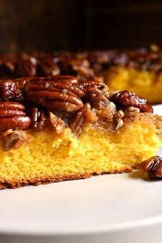 a piece of cake with pecans on top