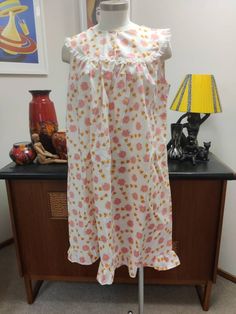 This one of three new old stock nighties from the 60s in a daisy print that I'm listing. This one is yellow hot pink and white. The condition is very good. Measurements are Bust 98cm  Length 92cm White Floral Print Dress For Pajama Party, Vintage White Nightgown For Sleepover, Sleeveless Cotton Floral Print Nightgown, Sleeveless White Floral Print Nightgown, Sleeveless White Nightgown With Floral Print, Vintage White Floral Print Nightgown, Retro Nightgown For Sleepovers, White Vintage Nightgown With Floral Print, Vintage Sleeveless Dress For Sleepover