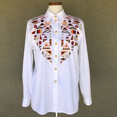 Amazing Deadstock Vintage Early 90s Escada Top. Original Tags Still Attached. White Cotton Boyfriend Style Women’s Button Down. Gold Buttons. Front Western Style Colorful Embroidery. Such A Stunning Timeless Top. Love This Piece, But It’s Sat In My Closet Unworn. On The Fence About Selling So Can’t Go A Ton Lower On Price. Length 27” Pit To Pit 21”. Traditional White Blouse With Buttons, White Embroidered Top For Work, White Embroidered Tops For Workwear, White Floral Embroidered Shirt For Work, Embroidered White Shirt For Work, Embroidered White Shirt For Workwear, Traditional White Button-up Tops, White Embroidered Shirt For Workwear, Traditional White Button-up Shirt