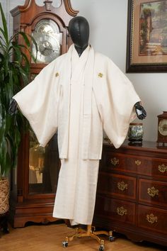 HAORI SIZE: Vertical Length: 94 cm (Collar Seam to Hem) Horizontal Length: 75 cm (Sleeve to Center Back Seam) Sleeve Depth: 54 cm (Sleeve Top to Bottom) Torso Width: 66 cm (Armpit to Armpit) KIMONO SIZE: Vertical Length: 143 cm (Collar Seam to Hem) Horizontal Length: 74 cm (Sleeve to Center Back Seam) Sleeve Depth: 53 cm (Sleeve Top to Bottom) Torso Width: 66 cm (Armpit to Armpit) FABRIC: Polyester GAUGE: Medium TEXTURE: Soft CONDITION: Excellent BLEMISHES: Slight collar edge stains. Please see gallery images for details. Please note white Hanjuban undergown shown in gallery images is not included. Kimono Ensemble is a combo set with Kimono gown and Haori jacket. Due to the nature of being a vintage textile product, the item might come with partial wrinkles, fold lines and stains. Most of Traditional Fitted Kimono With Kimono Sleeves, Traditional Sets With Kimono Sleeves For Wedding, Traditional Wedding Sets With Kimono Sleeves, Traditional White Robe With Kimono Sleeves, Traditional Long Kimono For Ceremonies, Traditional Long Fitted Kimono, Traditional Fitted Long Kimono, Traditional Long Wedding Robe, Traditional White Kimono For Ceremonies