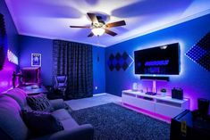 a living room with purple and blue lighting