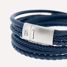 This wraparound bracelet stack, handcrafted from fine grade genuine leather and meticulously braided, is a timeless classic marked by elegance.- WIDTH: 12 mm- MATERIAL TYPE: 100% genuine Cowhide leather- CLASP COLOR: Brushed silver- CLASP MATERIAL: 316L stainless steel- CLASP TYPE: Magnetic Wrap Armband, Double Wrap Bracelet, Gold Armband, Bracelet Blue, Brushed Steel, Handcrafted Leather, Blue Bracelet, Bracelet Stack, Steel Bracelet