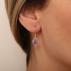 Amethyst helps to reduce stress, increase attention and concentration, and provide emotional balance.  Our 14K solid gold dangling round amethyst earring surrounded by diamonds is suitable for daily use with its special design and is a stylish jewelery that you can use on your special days and gift it to your loved ones. A stylish jewel for you and your loved ones. Time to pamper yourself and your loved ones... Amethyst is the birthstone for those born in February. 🤍🤍 Special gifts for your sp Fine Jewelry Round Birthstone Earrings, Delicate Prong Set Drop Earrings, Yellow Gold Birthstone Earrings, Yellow Gold Birthstone Earrings With Round Cut, Yellow Gold Birthstone Drop Earrings, Yellow Gold Drop Earrings With Birthstone, Yellow Gold Halo Design Earrings Gift, Delicate 14k Gold Gemstone Earrings, Elegant 14k Gold Earrings With Birthstone