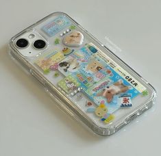 a clear case with stickers on it sitting on top of a white countertop