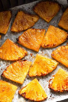 pineapple slices on a baking sheet ready to be cooked