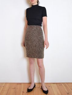 Cool vintage pencil skirt made of unique fabric -  thick wool blend knit fabric with fuzzy texture and mix of tones: brown, green, gray with tiny hints of red and blue. Closes with zip and button on the back. A pleat on the back hem. Lined. Era: 70s Fabric: no label, most likely wool blend Condition: very good Estimated size: XS / XXS  (please, check the measurements) Measurements (measured flat - need to be doubled to get the circumference): Waist: 32 cm / 12,6 inches Length: 62 cm / 24,4 inche Vintage Pencil Skirt, 70s Fabric, Fuzzy Texture, Tweed Pencil Skirt, Brown And Green, Green Wool, Cool Vintage, Knit Skirt, Red And Blue