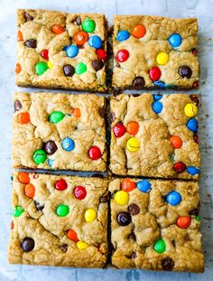 chocolate chip cookie bars with m & m candies on the top one is cut into squares