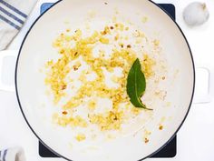 a white plate topped with food on top of a stove