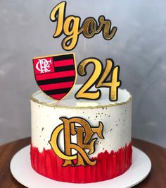 a cake with the number twenty four on it and an acrylic coat of arms