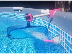 an inflatable pool pump attached to the side of a swimming pool with blue water