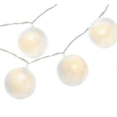 three white christmas balls hanging from a string