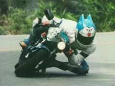 a person riding a motorcycle on the road