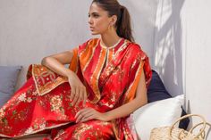 This worked bright coral pop khaddi silk cape is a sight for sore eyes. The inserts of bright vermillion with the printed vermillion charmeuse sari is styled and draped effortlessly to be cool and contemporary. Silk Cape, Sore Eyes, Website Features, Full Set, Online Branding, New Product, Cape, Coral, Saree