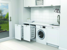 an image of a kitchen setting with washer and dryer