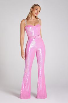 Set for fun and flirtation in BELT SEQUIN JUMPSUIT IN PINK. A sensual pink design made to remember the night. The iridescent pink jumpsuit features diamanté embellished detachable straps with elastic loops to adjust the size to fit. Featuring wired bra cups and internal corset boning to the front. back. and sides to cinch. support. and shape your silhouette. Finish with an invisible zipper for a sleek finish. - Iridescent pink sequin- Underwire bra cups - Structured internal corset with boning - Pink Sequined Jumpsuits And Rompers For Party Season, Pink Fitted Jumpsuits And Rompers With Sequins, Fitted Pink Sequined Jumpsuits And Rompers, Pink Sequined Jumpsuits And Rompers For Summer, Glamorous Pink Jumpsuits And Rompers For Party Season, Glamorous Pink Jumpsuits For Party Season, Glamorous Strapless Jumpsuit For Prom, Elegant Pink Jumpsuit For Party, Pink Strapless Jumpsuit For Summer Evenings