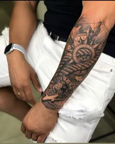 a man with a tattoo on his arm