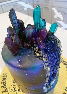 there is a cake that has many crystals on it