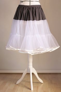 a mannequin with a skirt on top of it