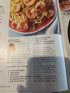 the recipe book is open to show shrimp and pasta