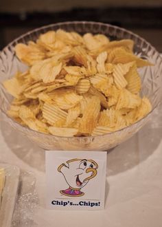 a bowl full of chips sitting on top of a table