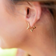 Be the envy of all your friends with these stunning Gold Star Huggie Earrings! Perfect for a special night out, these cuties have the star power to show off your unique style. Let your light shine! 🌟 From April 24, 2024 – December 31, 2024, Golden Thread will donate 20% of sales from each item in the Wish Collection, both online and in-store, to Make-A-Wish. Trendy Hoop Earrings With Star Charm For Party, Trendy Party Hoop Earrings With Star Charm, Elegant Star-shaped Hoop Earrings For Party, Star-shaped Hoop Earrings With Star Charm For Party, Star Charm Hoop Earrings For Party, Gold Star Hoop Earrings For Party, Gold Star-shaped Hoop Earrings For Party, Trendy Star Embellished Jewelry For Parties, Trendy Star Embellished Jewelry For Gifts