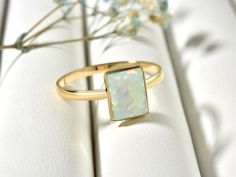 Genuine Rectangle White Opal Ring For Women, Simple Opal Birthstone Ring For Sister, Real Opal Band Ring For Wedding This stunning Opal Ring is a unique and dazzling accessory. Handcrafted from Sterling silver and/or Gold, it features a beautiful Opal Stone in the center. The elegant 22K gold plating is done by hand, giving it a brilliant shine. Our handcrafted jewelry is made to last and can be worn everyday for that eternally beautiful look! What does this ring symbolize? It is a symbol that t Rectangular Birthstone Ring For Wedding, Rectangular Birthstone Wedding Ring, Wedding Crystal Ring With Rectangular Gemstone, Rectangular Gold Birthstone Ring For Wedding, Gold Wedding Ring With Rectangular Stone, Gold Crystal Ring With Rectangular Stone For Wedding, White Rectangular Wedding Rings, Rectangular White Wedding Rings, Opal Birthstone Ring