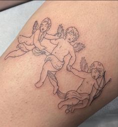 a tattoo on the leg of a man with angels