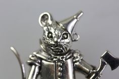 Beatrix Potter Tin Man Mouse Brooch  Made of Sterling Silver  Length 35 mm x 32 mm  Fine engraved details wearing a cute hat and holding an axe Tin Man Wizard Of Oz, Mouse In A Tin, Wizard Of Oz Tin Man, Luxury Vintage Silver Enamel Pin, Vintage Silver Cat Design Jewelry, Tin Man, Beatrix Potter, Cute Hats, Daughter Birthday