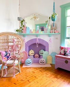 a living room filled with furniture and a fire place in the middle of a wooden floor