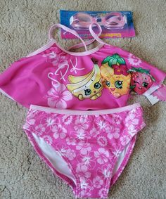 Brand new with tags Shopkins Girls size 6X Two piece tankini set Comes with goggles! Smoke and pet free home Shopkins Girls, Swimsuit Tankini, Pokemon Bead, The Early 2000s, Swim Sets, Pink Swimsuit, Swim Tankini, Tankini Set, Tankini Swimsuits