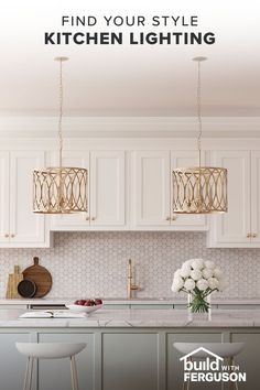 a kitchen with white cabinets and gold lighting fixtures