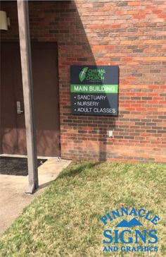 a sign on the side of a building that says main building sanctuary library adult classes