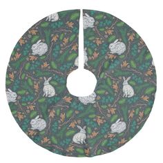 an image of a christmas tree skirt with rabbits and leaves on the bottom, as well as text