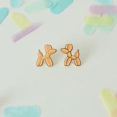 Delight your balloon enthusiast with our adorable Balloon Dog Earrings. Crafted from hard enamel, these gold-plated brass earrings radiate charm. Nickel-free for sensitive skin. Each earring stands 0.75” tall and 0.75” wide. Gift joy and style today! Trendy Hypoallergenic Enamel Earrings, Playful Gold Enamel Earrings, Playful Enamel Earrings Nickel Free, Playful Enamel Nickel Free Earrings, Playful Enamel Nickel-free Earrings, Playful Gold Earrings, Playful Gold Single Earring, Playful Gold Earrings For Gift, Playful Gold Earrings As A Gift