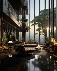 a living room filled with lots of furniture and tall windows next to a tree covered hillside