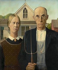 an old man and woman holding a large metal utensil in front of a house