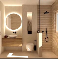 a modern bathroom with round mirrors above the toilet