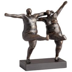 two bronze figurines are standing on their hind legs, one holding the other's head