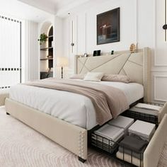 a bedroom with a large bed and white walls