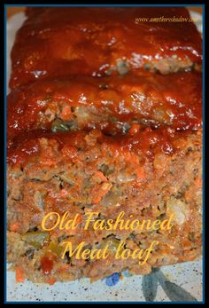 meatloaf with sauce and vegetables on a plate